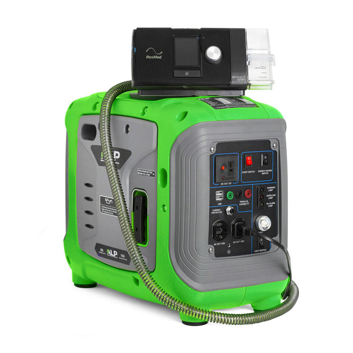 ALP 1000W Portable Powered Generator in Green and Grey Color charging a medical device