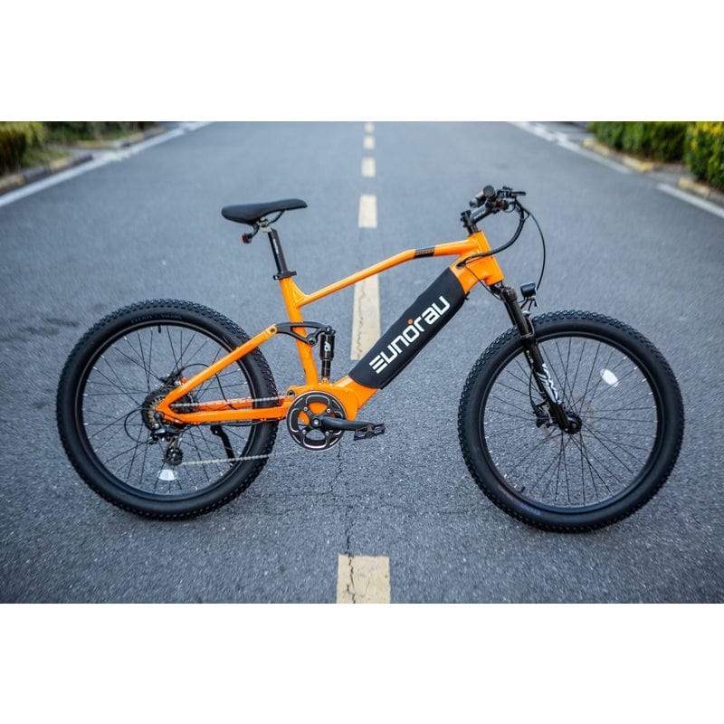 Eunorau Defender Fat Tire Dual Motor Electric Mountain Bike in Orange Color in the street