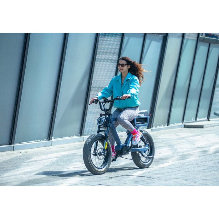 Woman riding Eunorau Flash Folding Electric Commuter Bike in lunar dust color