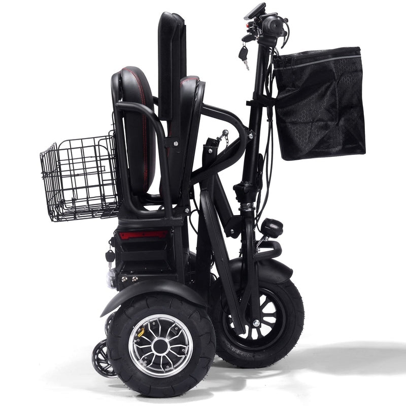 Folded black MotoTec Folding Mobility Electric Trike 48v 1000w Dual Motor Lithium with a wire basket on the back and a fabric bag on the front.