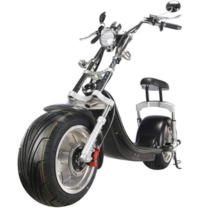 Low-angle view of the MotoTec Knockout 60v 2500w Lithium Electric Scooter Black, highlighting its large tires, handlebars, and small seat, powered by a powerful 60V 2500W motor with a lithium battery.