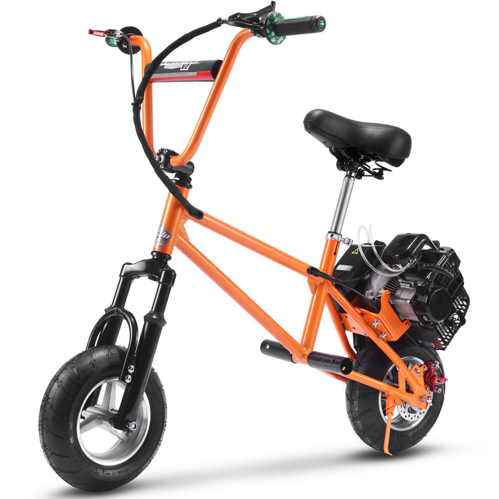 The MotoTec 49cc Gas Mini Bike V2 is an orange mini bike featuring fat tires, a black seat, a visible engine, a 49cc gas motor for efficient transportation, and BMX-style handlebars.