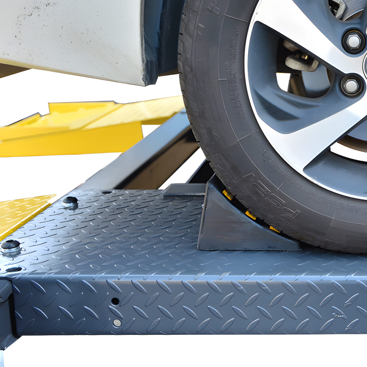 AMGO 409-DP optional rubber wheel chock placed against a vehicle tire on the runway