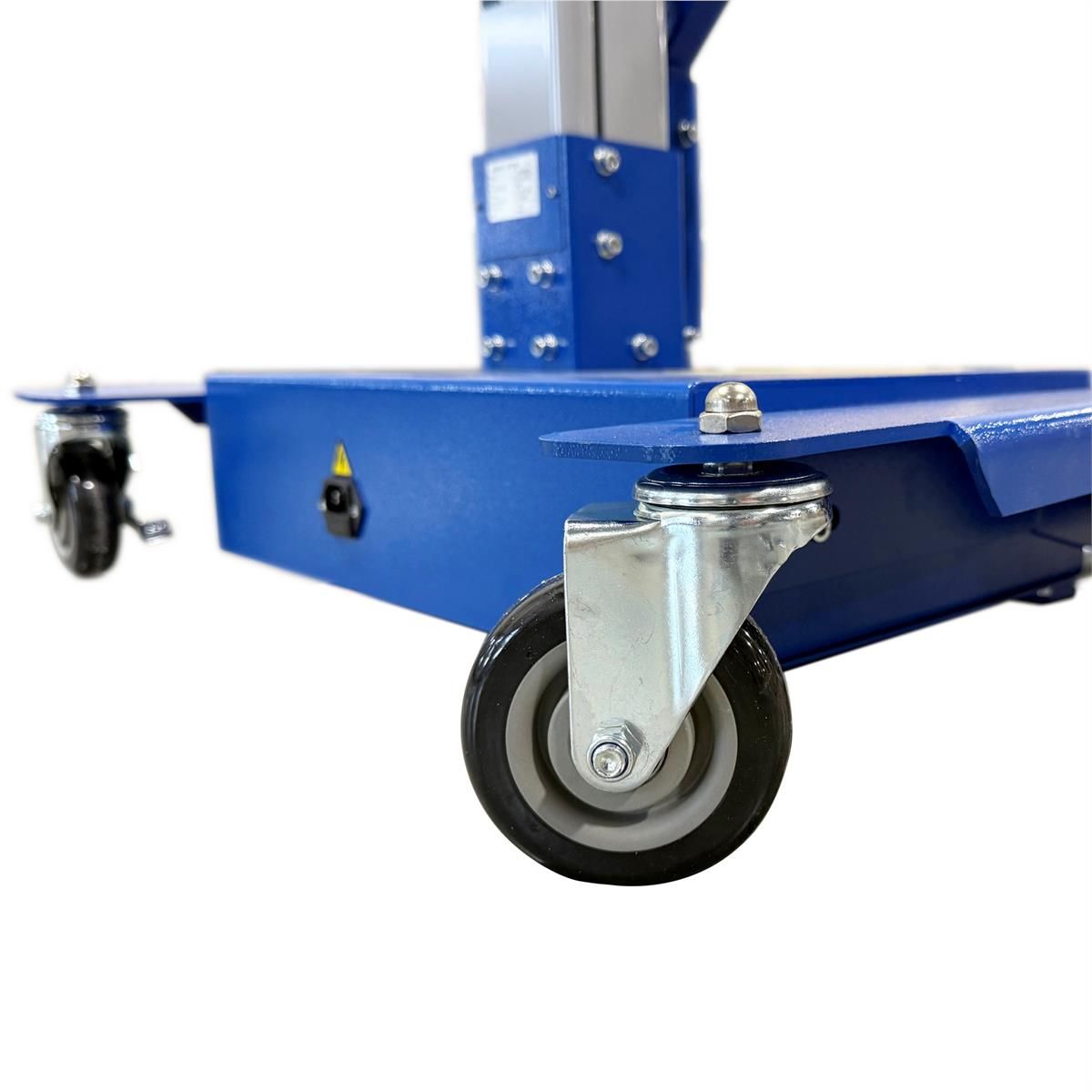 Close-up of the wheel lift's base frame, power switch, and swivel caster