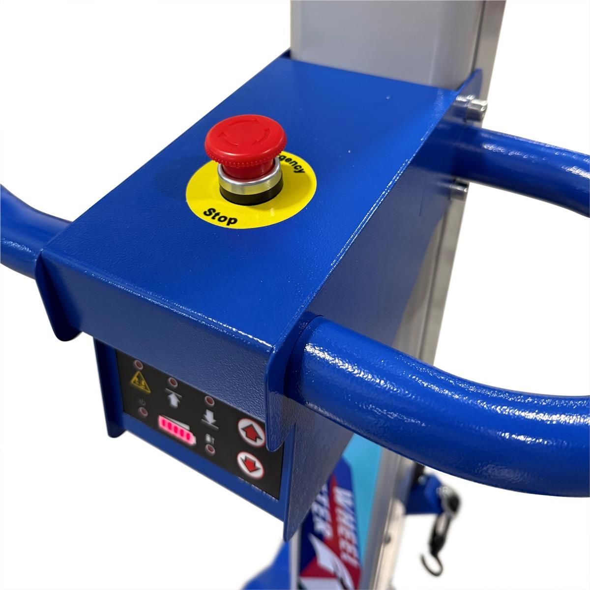 Control head close-up with emergency stop button and carry handle