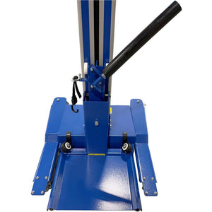 Close-up of the wheel lift's base with swivel casters and tie-down hook