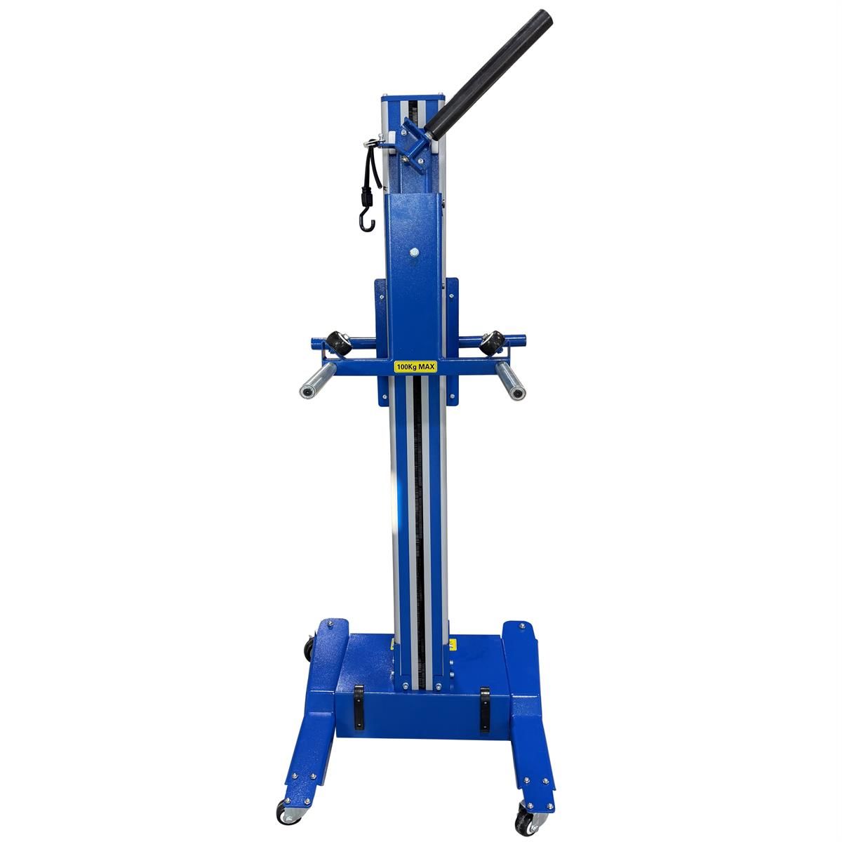 Wheel lift with roller arms extended and tie-down strap hanging