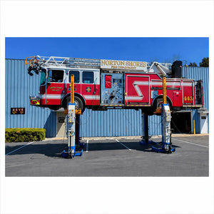 Atlas ML-4034BC mobile column lift system raising a Norton Shores Fire Department fire truck outdoors