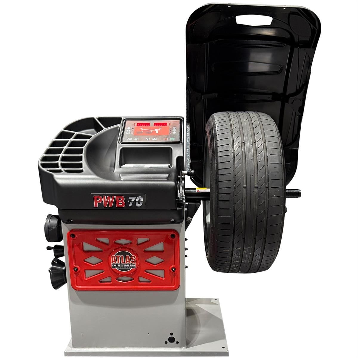 Atlas Platinum PWB70 wheel balancer with mounted Continental tire on alloy wheel and LED display panel lit