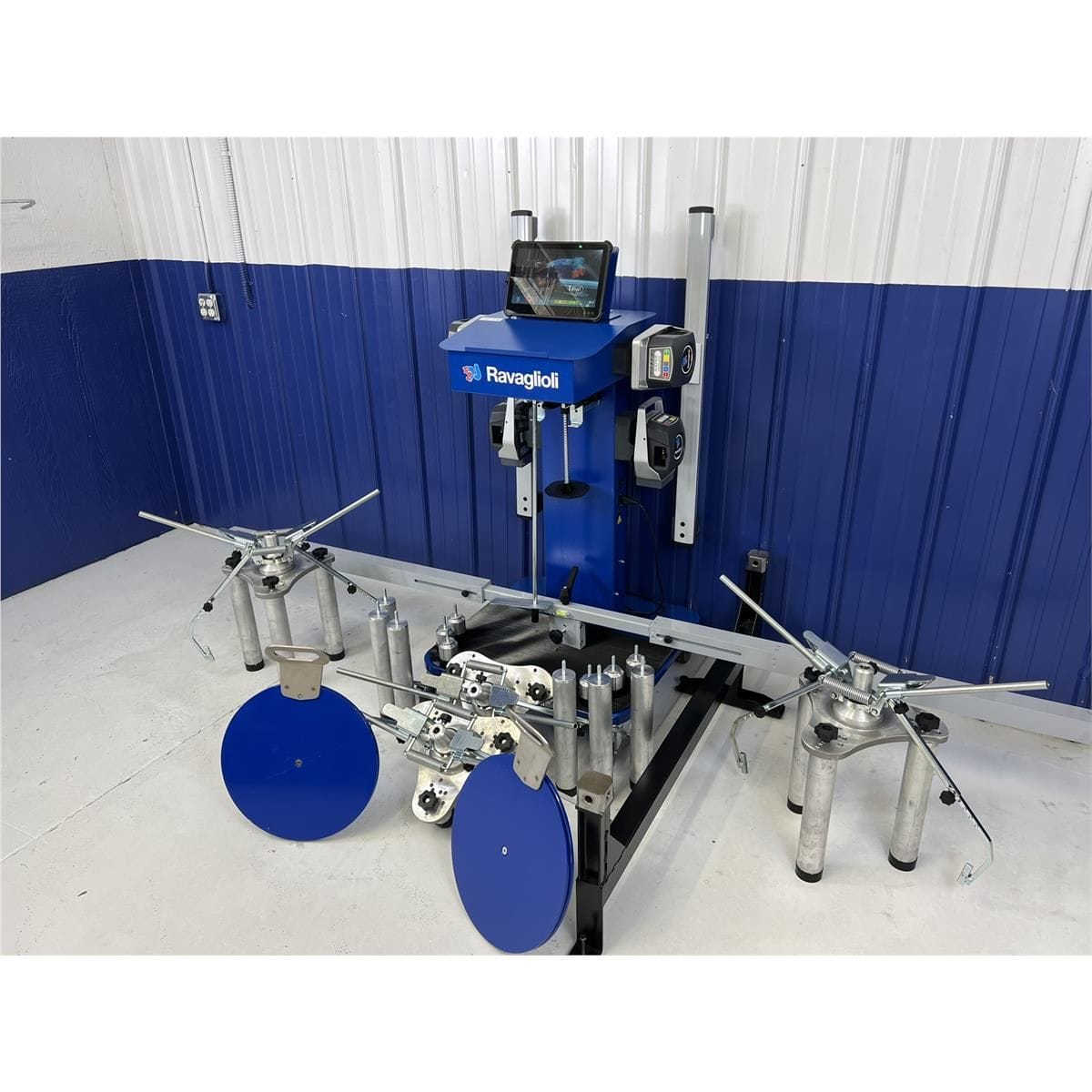 Atlas TD6000CNA Spirit alignment system three-quarter view with deployed clamps, turntables, and adapter set