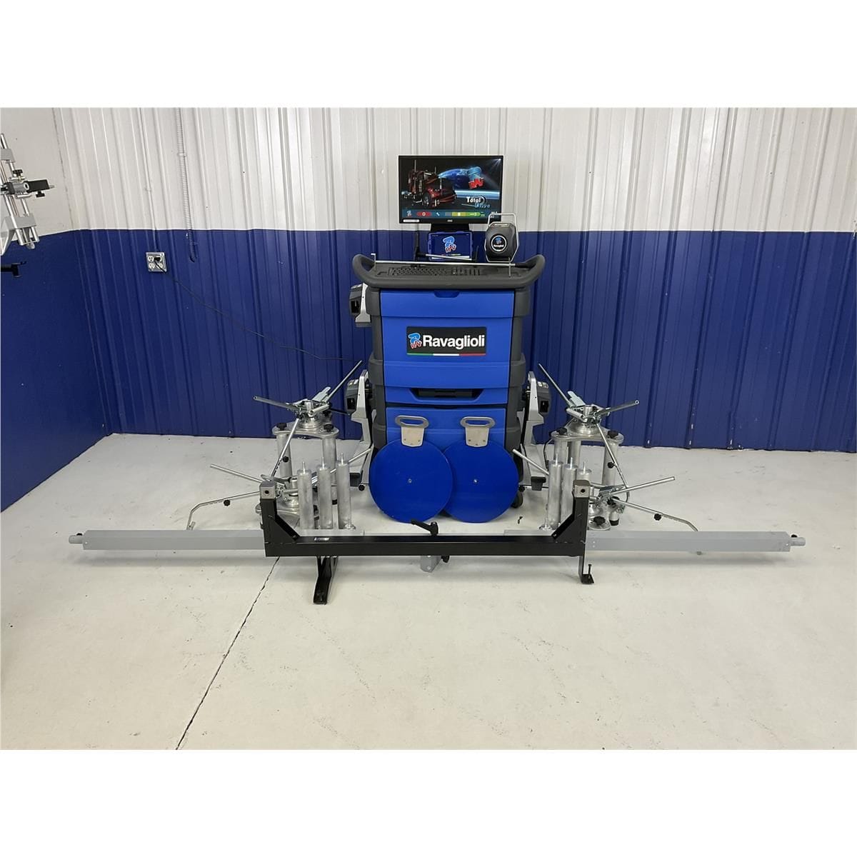 Atlas TD8060NA truck aligner with trailer alignment fixture extended, showing full trailer measurement setup