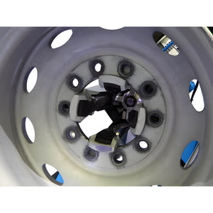 Close-up of adapter mounted inside truck wheel lug holes