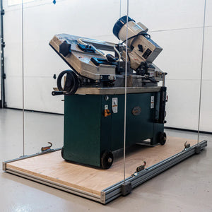 Attic-Lift platform on the floor loaded with a heavy shop machine