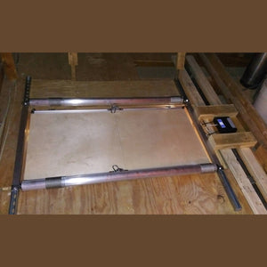 Two tubular motors mounted on strut channels in an attic with the control box