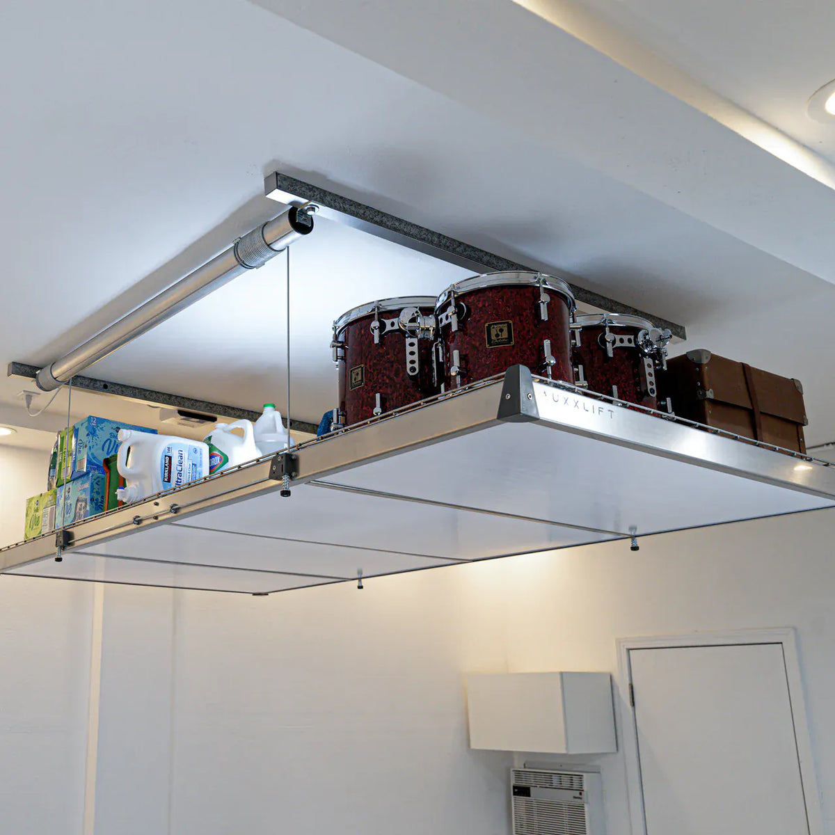 Overhead view of the Auxx-Lift ceiling-mounted strut channel and dual motor arms