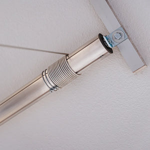 Steel lifting cable wound around an Auxx-Lift tubular motor bolted to the ceiling strut channel