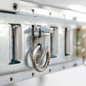Round-ring snap-in anchor installed in the slotted E-Beam track