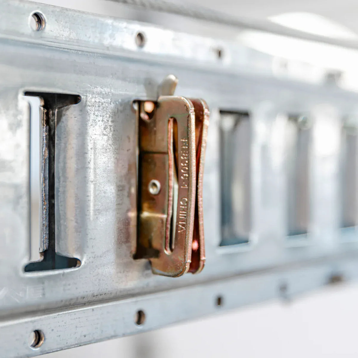 Zinc-plated snap-in anchor seated in the galvanized E-Beam slot