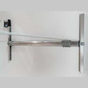 Auxx-One motor mounted between two strut channels with wall-mounted controller box