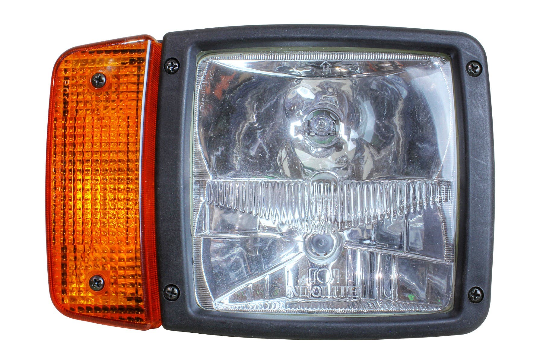 Close-up of a halogen light with clear glass lens and amber turn signal