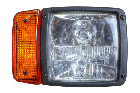 Close-up of a halogen light with clear glass lens and amber turn signal