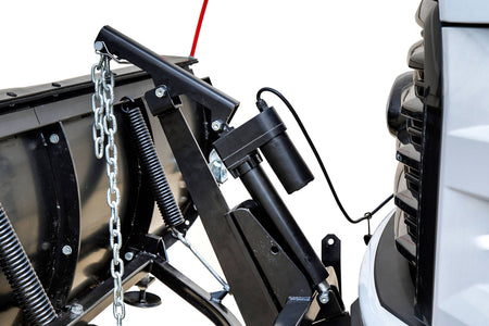 Close-up of the electric actuator, lift arm, chain and trip springs at the front of a truck