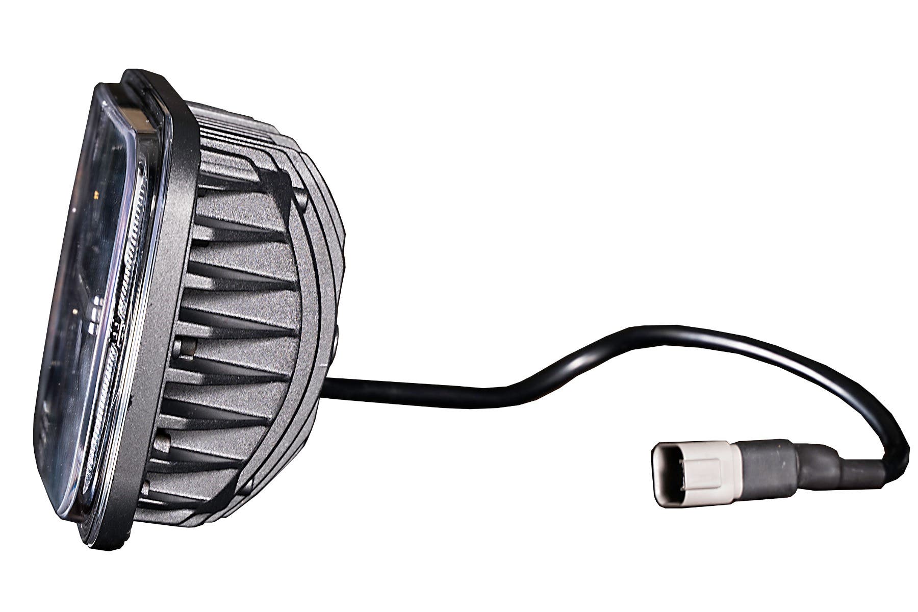 Side profile of an LED light with finned housing and pigtail connector