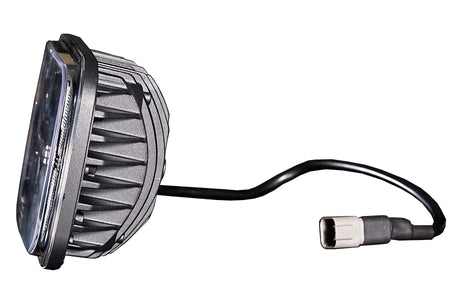 Side profile of an LED light with finned housing and pigtail connector