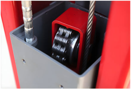 Lifting chain over the sprocket inside the column with the steel equalizer cable