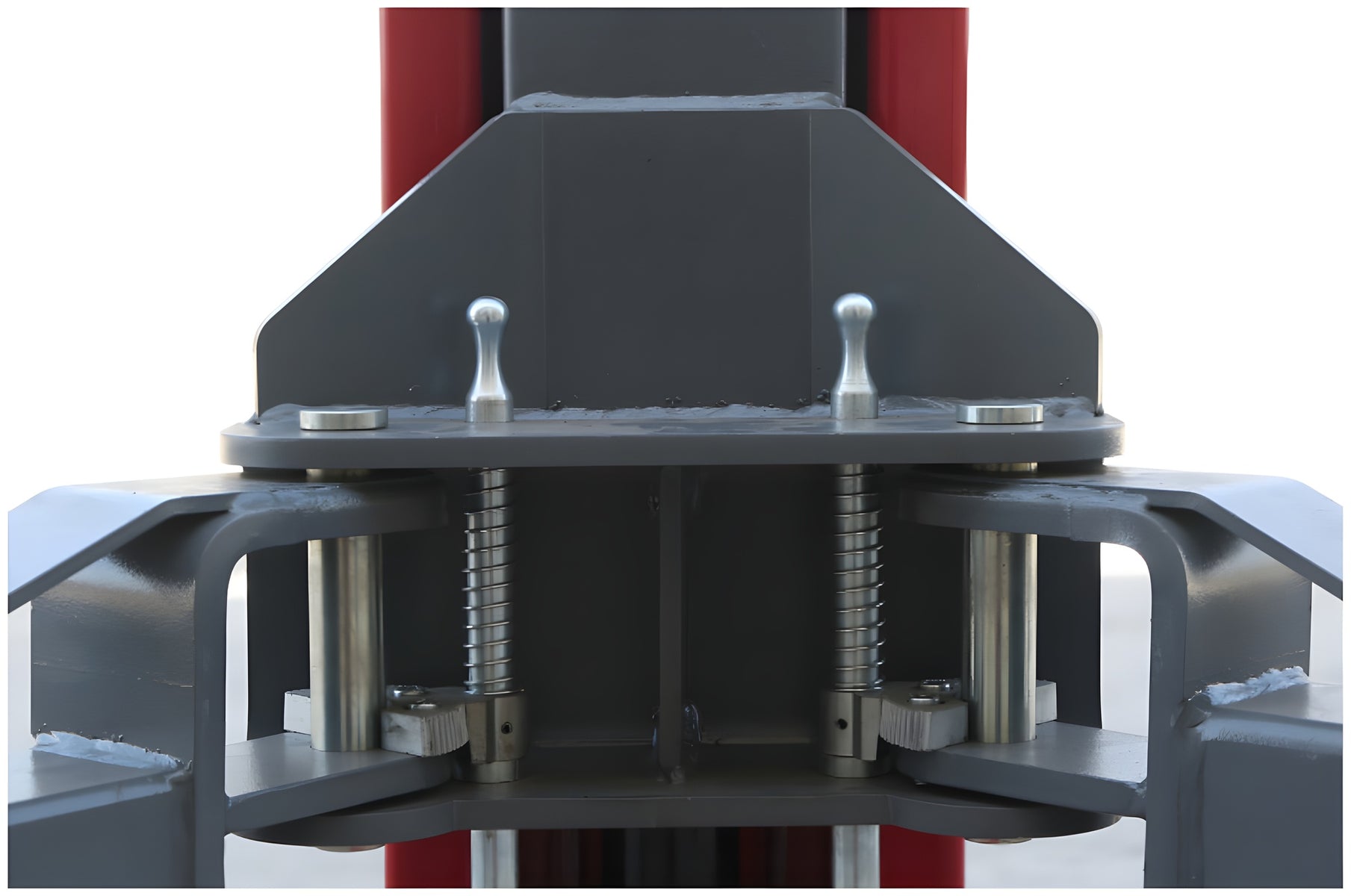 Carriage front view showing both spring-loaded automatic arm restraint pins