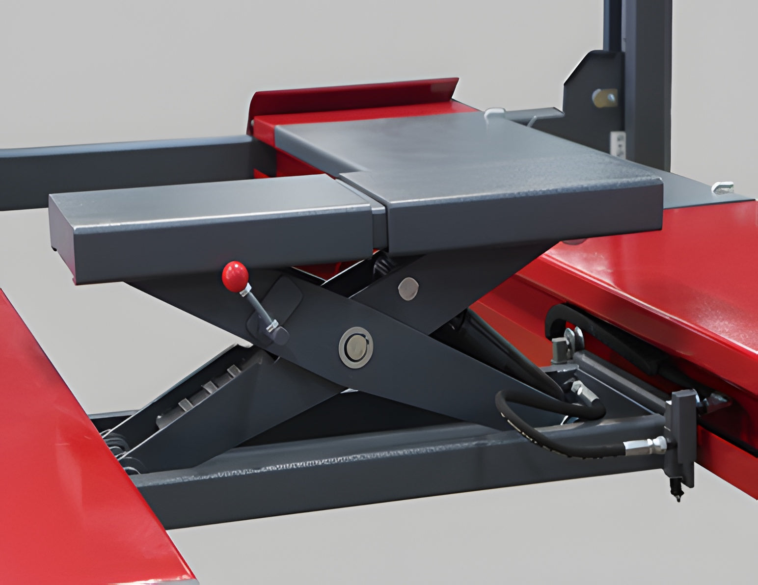 7,000 lb rolling jack on the runways with red release knob and hydraulic line