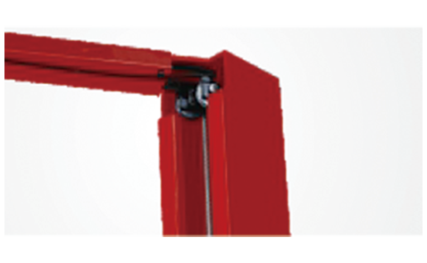 Overhead beam corner showing the cable and pulley inside the beam