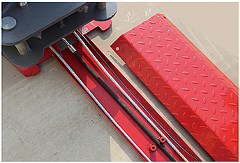 Floor plate channel with hydraulic hose and equalizer cables under the diamond-plate cover