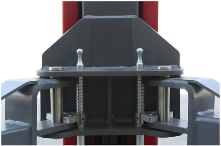 Carriage front view showing both spring-loaded automatic arm restraint pins