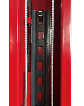 Inside the column: equalizer cables alongside the carriage track