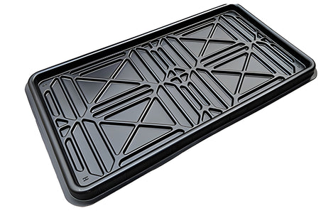 Black drip tray that sits between the runways