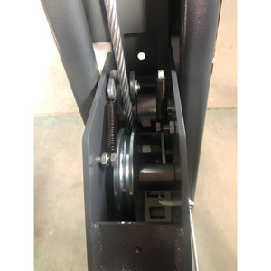 Cable sheave and safety lock close-up inside the column