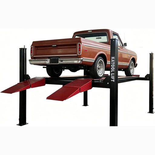 Katool KT-4M110PA four-post lift raising a classic pickup on red diamond-plate ramps