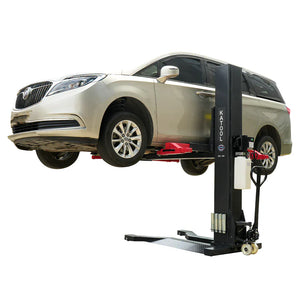 Buick MPV raised on the Katool KT-SPL700 7,000 lb single post lift for under-vehicle service.