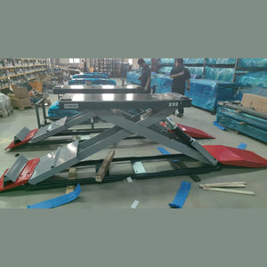 Katool KT-X99 full-rise scissor lift on the assembly floor with side platforms and ramps