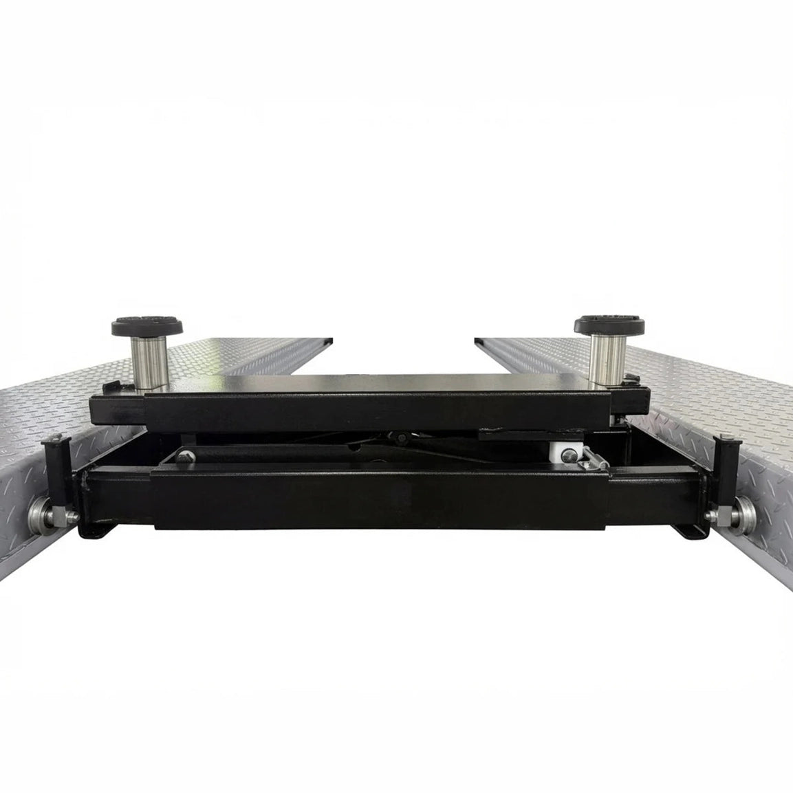 Lowered rolling bridge jack showing cross-rails and end roller wheels on the runways