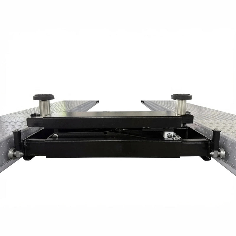 Lowered rolling bridge jack showing cross-rails and end roller wheels on the runways