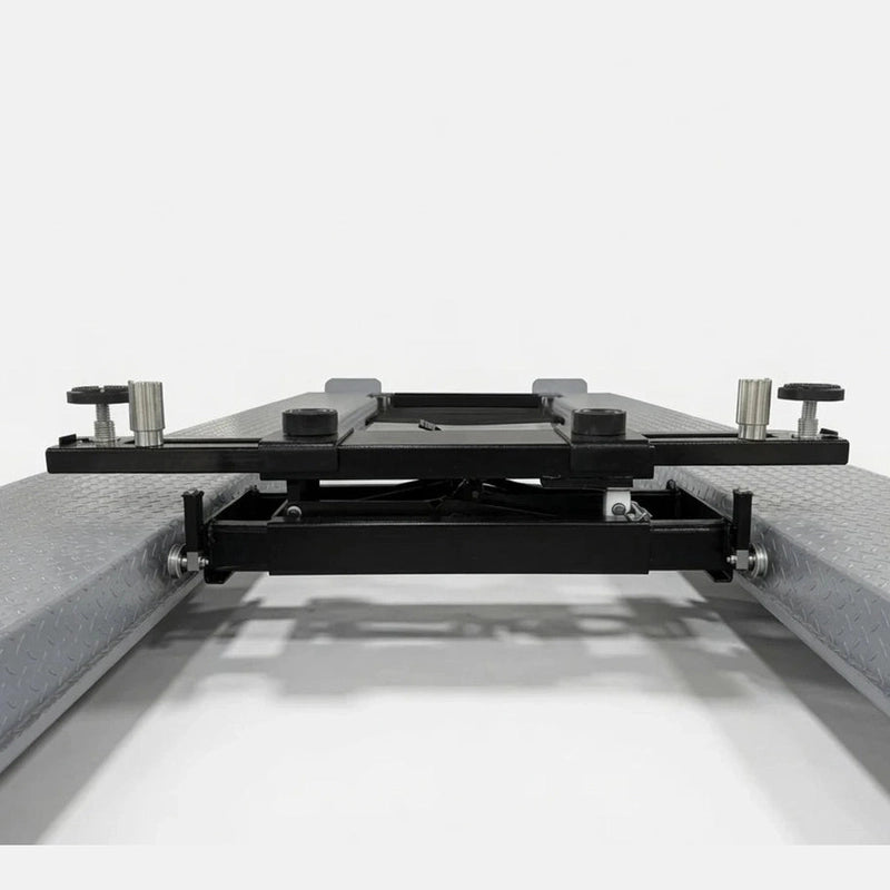 Rolling bridge jack fully lowered on the lift runways showing its low profile