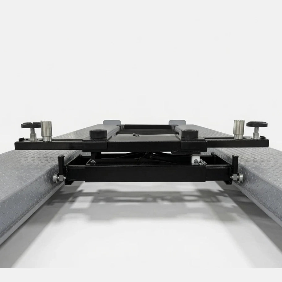 Rolling bridge jack fully lowered on the lift runways showing its low profile