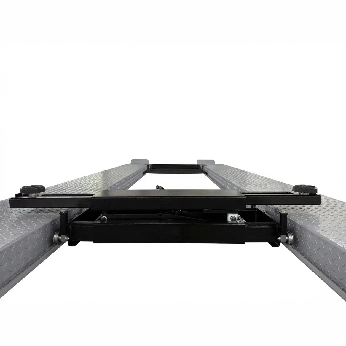 Top-down view of the rolling bridge jack spanning the four-post lift runways