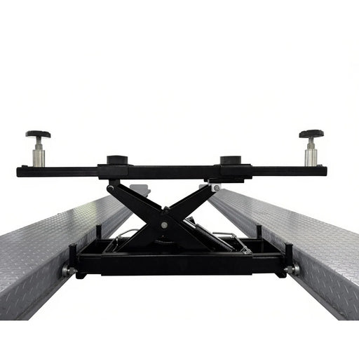 Triumph RJ-5 rolling bridge jack raised between four-post lift runways
