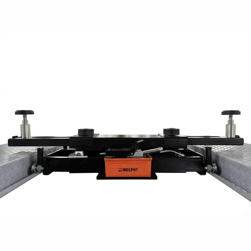 Orange hydraulic foot pump and release lever at the base of the rolling bridge jack