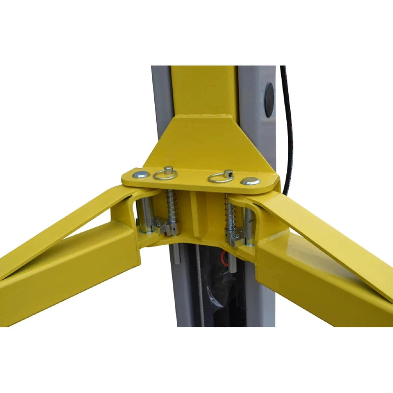 Close-up of the dual gear-type arm restraints with spring-loaded pull pins at the lift carriage