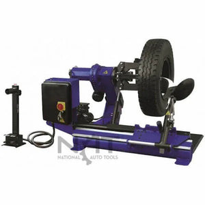 Triumph NTC-650 truck tire changer with a large truck tire mounted on the clamping arm