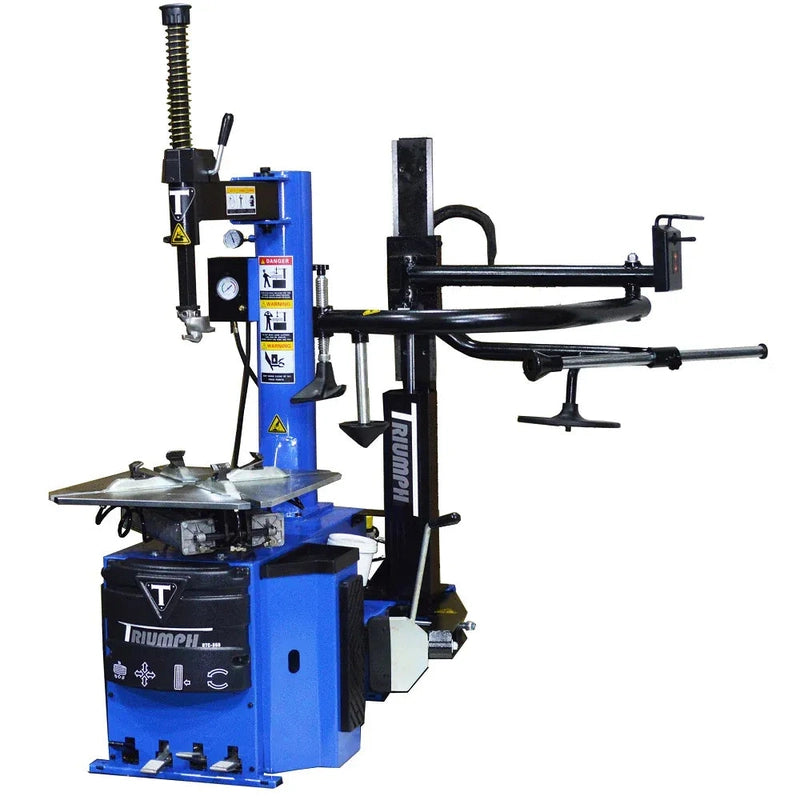 Triumph NTC-950-1 tire changer with the single assist arm swung out to the side